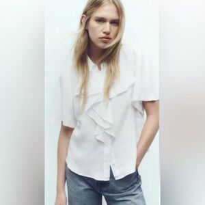 White Ruffled Blouse and Blue Jeans